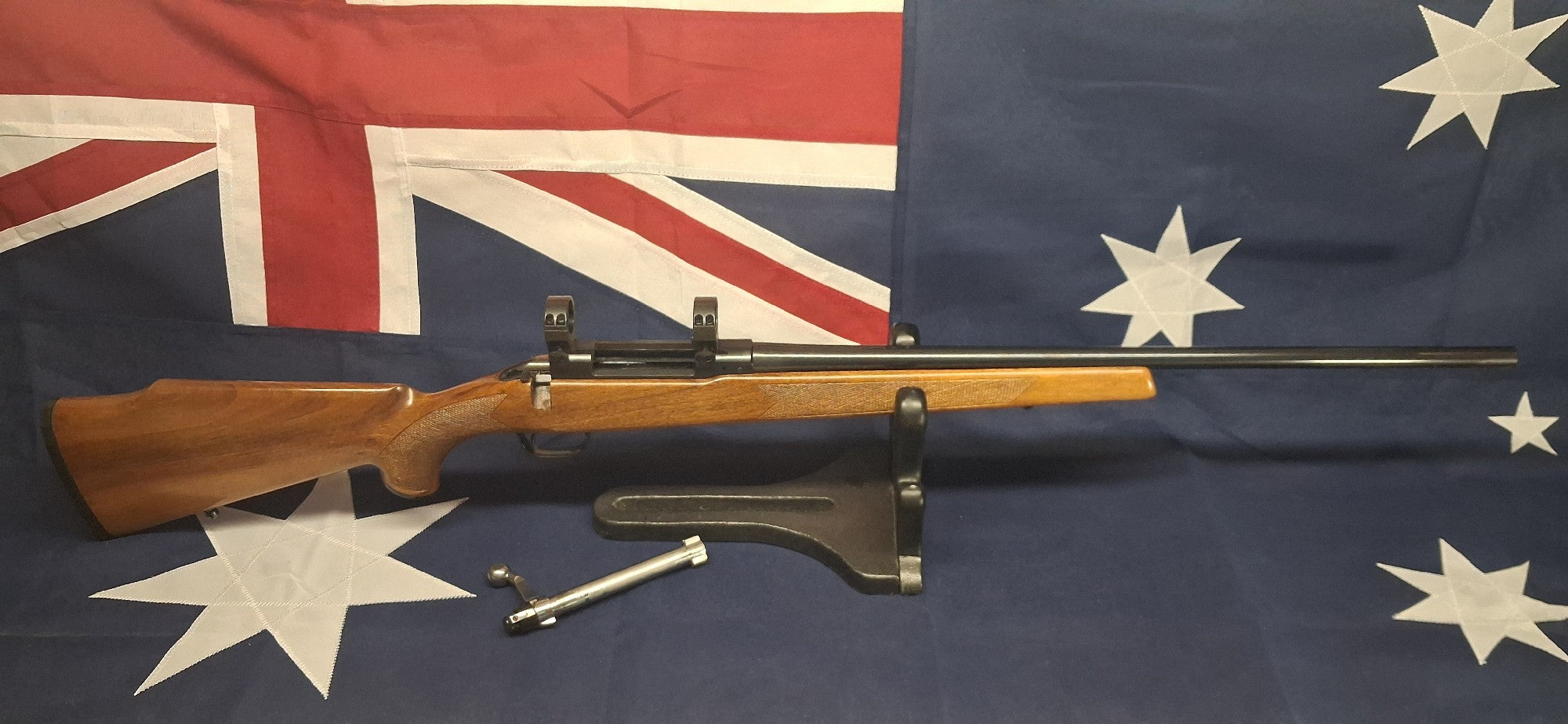 TIKKA LSA-55 243WIN BLUED BARREL WOOD STOCK WITH 1" RINGS